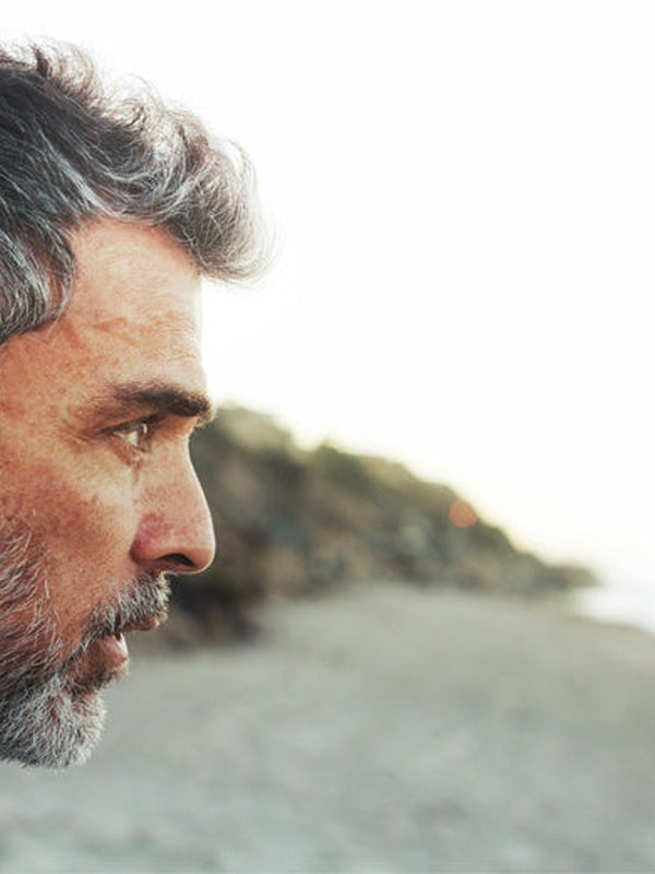 Thoughtful man outdoors in official Melrose FutureLab Neuro-Stress Modulator lifestyle imagery