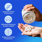 Hands holding Melrose FutureLab NMN 250mg capsules and jar against a blue background
