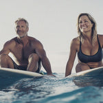 Active mature couple on paddleboards in official Melrose FutureLab Omega 3-11 lifestyle imagery
