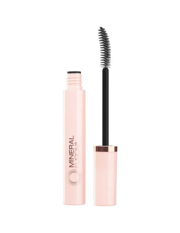 Open pale pink tube of Mineral Fusion So Lifted mascara in Black beside its upright wand with a curved black brush and rose-gold cap band.