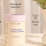 Cream Mister Jones Unflavoured Bovine Collagen canister with a lilac lid beside a vase of foliage, with Naturopath Approved and Bovaer Free captions.