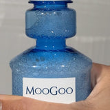 MooGoo Moothwash Spearmint bottle in hand