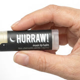 Hand holding Hurraw! Moon Lip Balm Blue Chamomile & Vanilla 4.8g