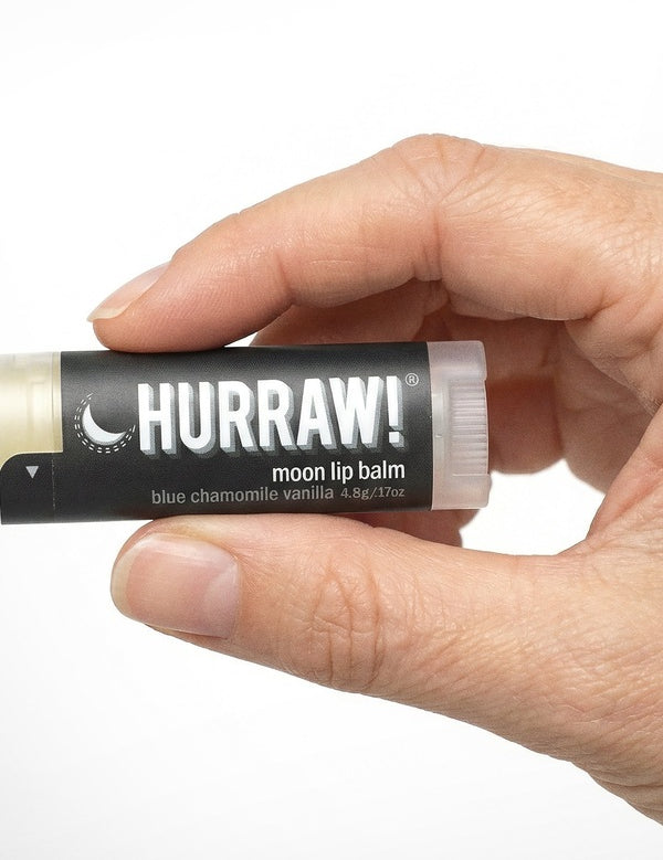 Hand holding Hurraw! Moon Lip Balm Blue Chamomile & Vanilla 4.8g
