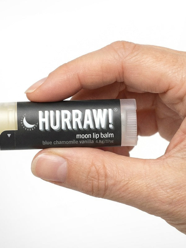 Hand holding Hurraw! Moon Lip Balm Blue Chamomile & Vanilla 4.8g