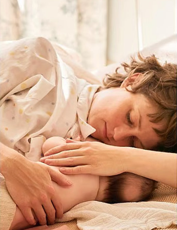 Mother breastfeeding her baby, representing Weleda Nipple Balm care.