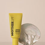 MOTHER SPF Tinted Base styled with a pearl shell