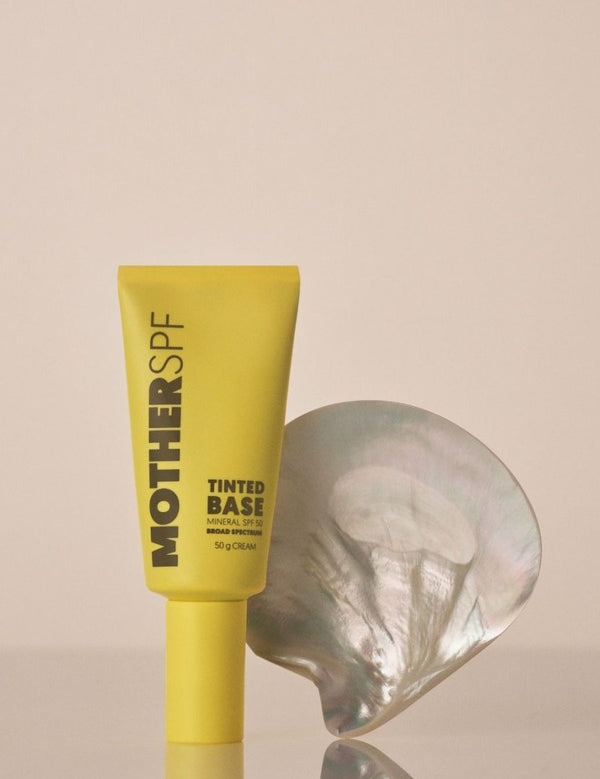 MOTHER SPF Tinted Base styled with a pearl shell