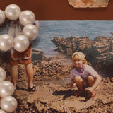 MOTHER SPF Mother of Pearl mood board with bronzing drops and pearls