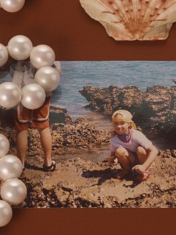 MOTHER SPF Mother of Pearl mood board with bronzing drops and pearls