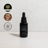 Black Mukti Antioxidant Facial Oil dropper bottle beside badges for 2024 Beauty Shortlist Editor's Choice, Mama and Baby award winner, and a 2023 Beauty Innovation Award.