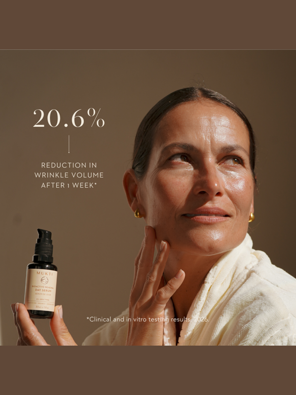 Woman holding Mukti Bioactive Renewal Day Serum with the official clinical wrinkle-volume result.
