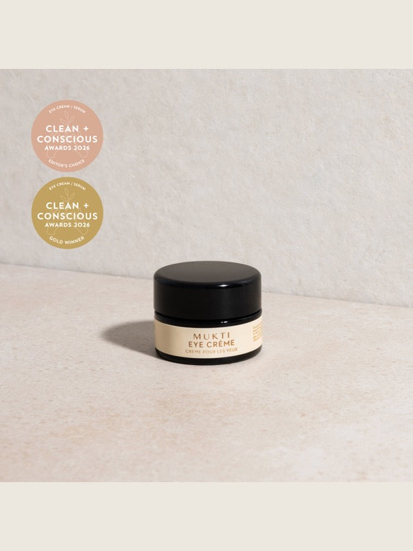 Mukti Bioactive Renewal Eye Crème styled on a light stone surface with its 2026 award badges.