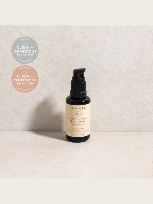 Mukti Bioactive Renewal Night Serum styled on a light stone surface with its 2026 award badges.