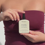 Woman holding Mukti Botanique Deodorant Citrus and Siberian Fir