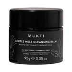 Wide black Mukti Gentle Melt Cleansing Balm jar with a glossy black lid, white lettering, outlined botanical leaves and 95g printed near the base.