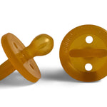 Two amber Natural Rubber Soother Large Rounded dummies shown from the side and behind, revealing the rounded teat, circular shield with two air holes, and loop handle.