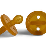 Two amber Natural Rubber Soother Large Rounded dummies shown from the side and behind, revealing the rounded teat, circular shield with two air holes, and loop handle.