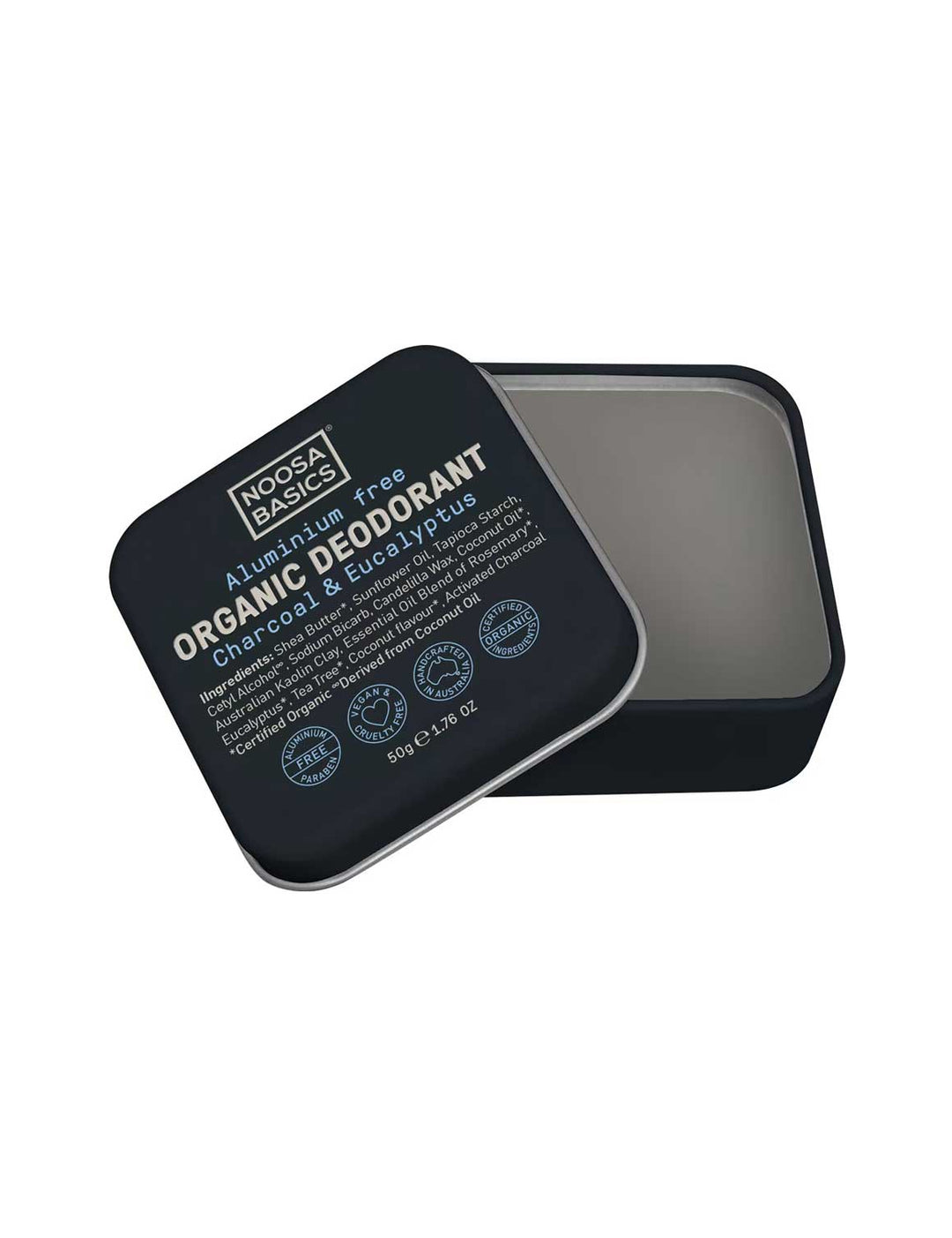 Open black square Noosa Basics Charcoal and Eucalyptus deodorant tin with rounded corners, showing smooth grey balm and its printed lid resting diagonally across the edge.