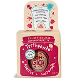 Kraft cardboard Oh Gigi Fruity Brush Toothpowder box with a raspberry-pink jar-shaped front panel and white lettering, topped by a tall tab decorated with a tooth outline and pink fruit illustrations.