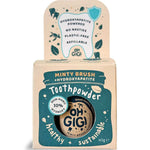 Kraft cardboard Oh Gigi Minty Brush Toothpowder box with a dark teal jar-shaped front panel and white lettering, topped by a tall tab decorated with a tooth outline and teal leaf illustrations.
