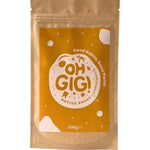 Brown resealable Oh Gigi Native Brush Toothpowder refill pouch with a large ochre label, bold lettering inside a cream circle, and scattered pale dots and shapes.