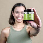 Botani Olive Repair Cream 120g — model holding olive repair cream
