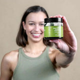 Botani Olive Repair Cream 120g — model holding olive repair cream