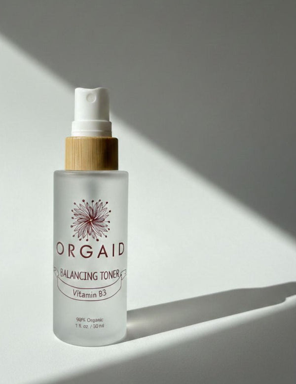 Orgaid Balancing Toner in soft window light