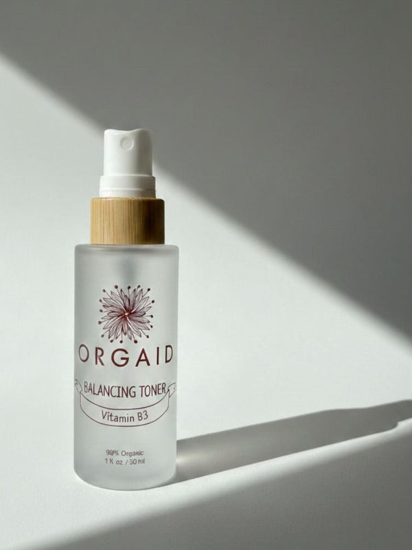 Orgaid Balancing Toner in soft window light