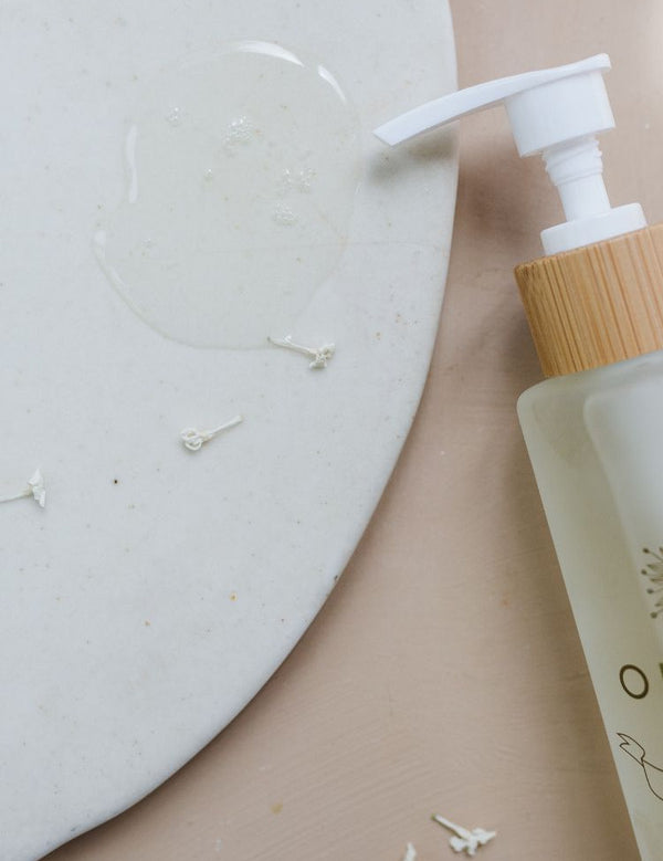 Orgaid Cleansing Oil styled on a bathroom vanity