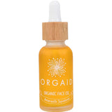 A 30ml glass bottle of Orgaid Organic Face Oil Amaranth Squalene with a wooden dropper cap contains yellow-orange amaranth squalene, features a white floral design, and has "Amaranth Squalene" labeled on the front.
