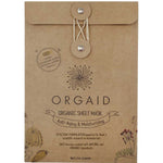 Kraft paper Orgaid Anti-Aging and Moisturising sheet-mask envelope with a string-and-button fastening, a black flower emblem and fine botanical drawings along the lower corners.