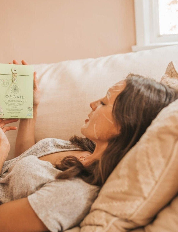 Woman relaxing in an Orgaid Firming Organic Sheet Mask