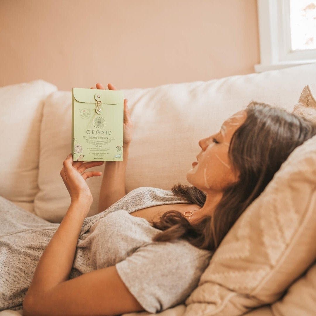Woman relaxing in an Orgaid Firming Organic Sheet Mask
