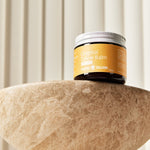 Original Tallow Balm jar displayed on a stone pedestal – Thrive Tallow Original Tallow Balm Scented 70ml