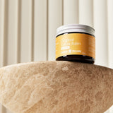 Original Tallow Balm jar displayed on a stone pedestal – Thrive Tallow Original Tallow Balm Scented 70ml