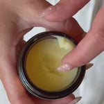 Hand taking Original Tallow Balm from an open jar – Thrive Tallow Original Tallow Balm Scented 70ml