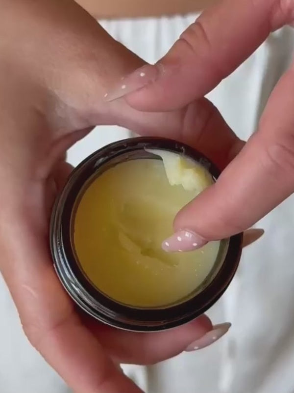 Hand taking Original Tallow Balm from an open jar – Thrive Tallow Original Tallow Balm Scented 70ml