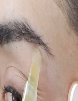 Parissa Brow Waxing Pen applied beneath the eyebrow