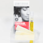 Several pale wax strips and a slim yellow-labelled tube arranged in front of a blurred Parissa Face and Lip Wax Strips box.