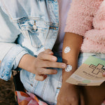 PATCH Bite Relief Spots applied to a child's arm