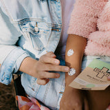 PATCH Bite Relief Spots applied to a child's arm