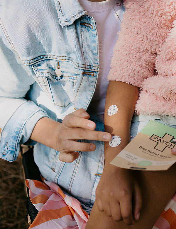 PATCH Bite Relief Spots applied to a child's arm
