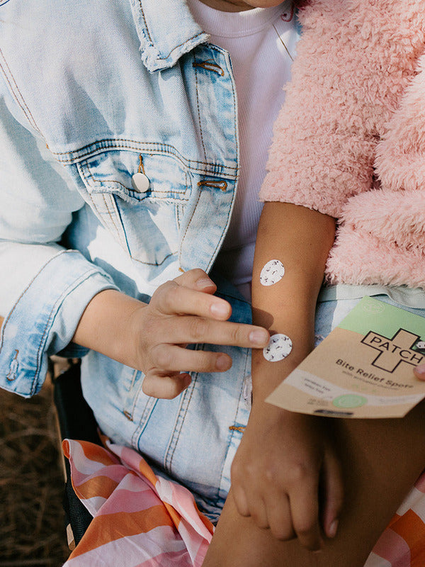PATCH Bite Relief Spots applied to a child's arm