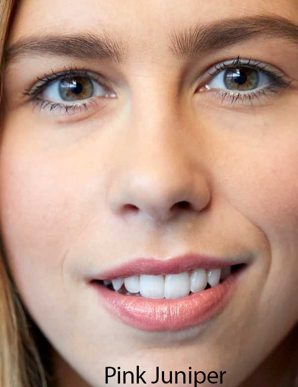 A close-up of a smiling woman with light skin, brown eyes, and pink lips wearing Luk Beautifood Lip Nourish Lipsticks 3g. The text Pink Juniper appears at the bottom of the image.