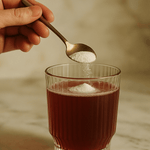 Pouring Tropeaka Marine Collagen Peptides into a drink
