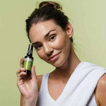 Botani Purify Facial Cleanser 100ml — model holding facial cleanser
