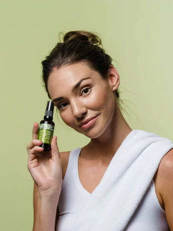 Botani Purify Facial Cleanser 100ml — model holding facial cleanser