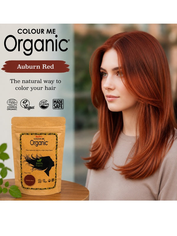 Radico Auburn Red graphic showing a woman with long, layered copper-red hair beside a brown paper hair-colour pouch, with the shade name printed on a reddish-brown brushstroke above.